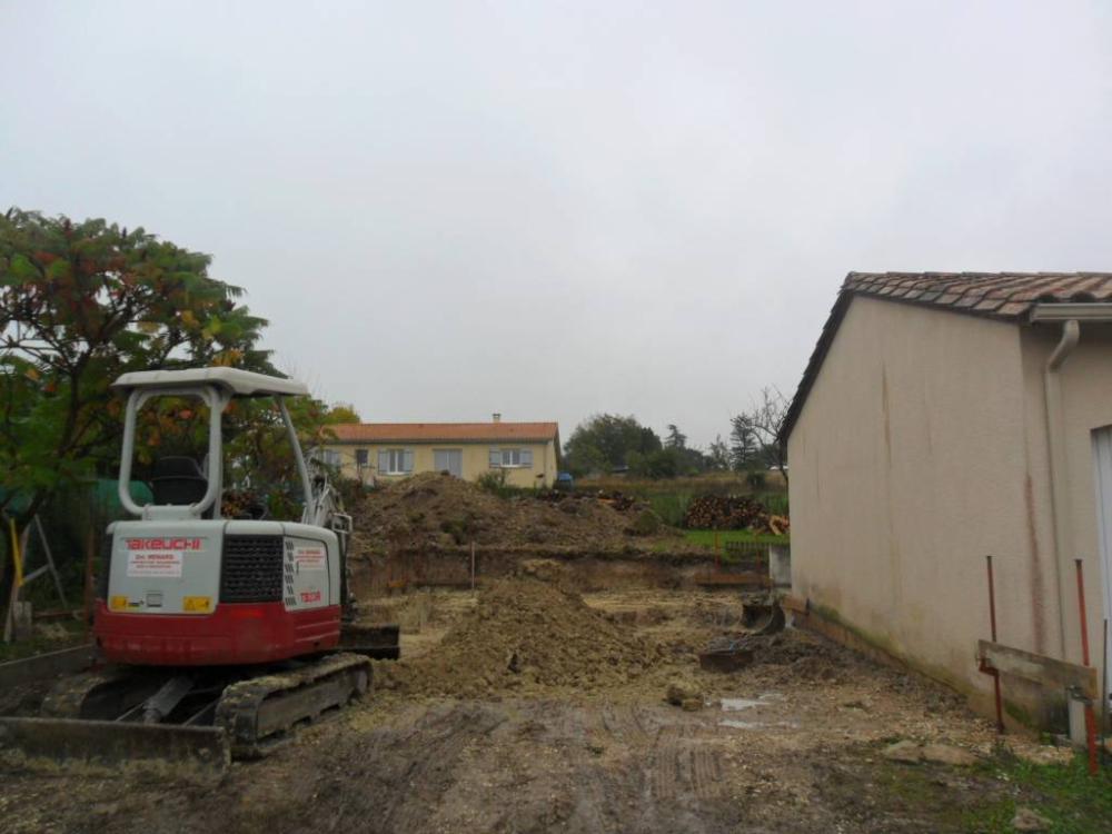 Pelleteuse-terrain-maison